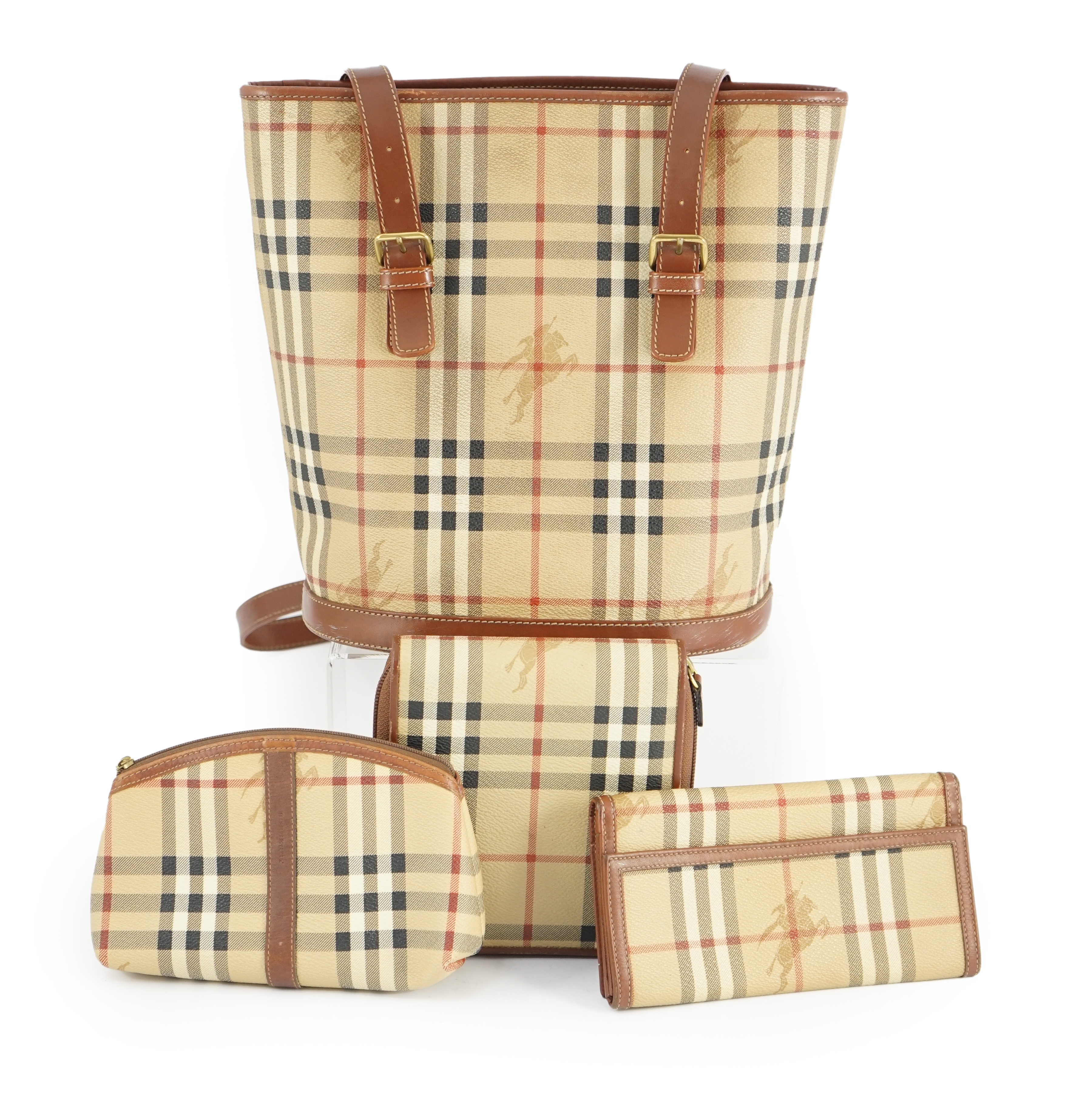 A Burberry Beige/Brown Haymarket coated canvas and leather bucket bag, wallet, cosmetic pouch and small zip case Bag: width 28cm, depth16cm, height 28cm. Wallet: width 20cm, depth 2cm, height 10cm. Cosmetic pouch: width1